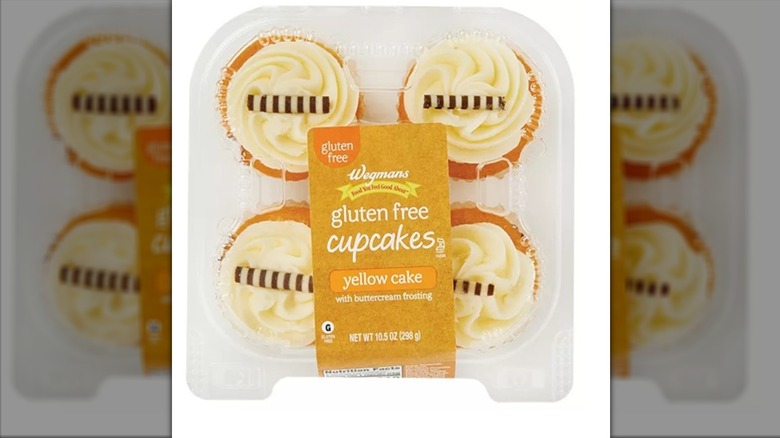 four pack of vanilla cupcakes with candy topping