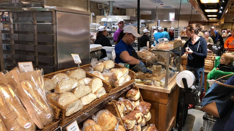 wegmans bakery associates serve customers in store
