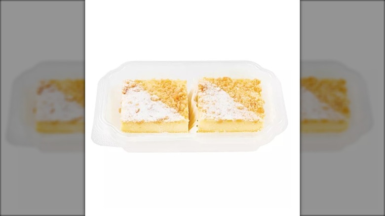 two lemon bars on a plastic dish