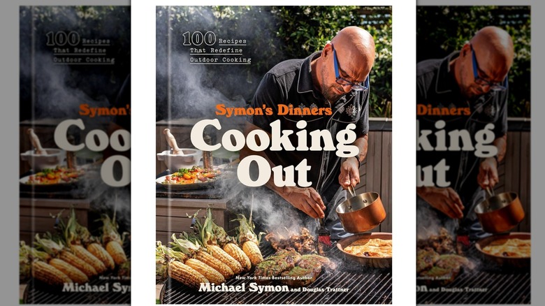 A copy of Symon's Dinners Cooking Out by Michael Symon
