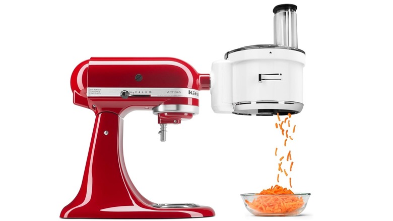 The KitchenAid KSM1FPA Food Processor attached to a red Stand Mixer