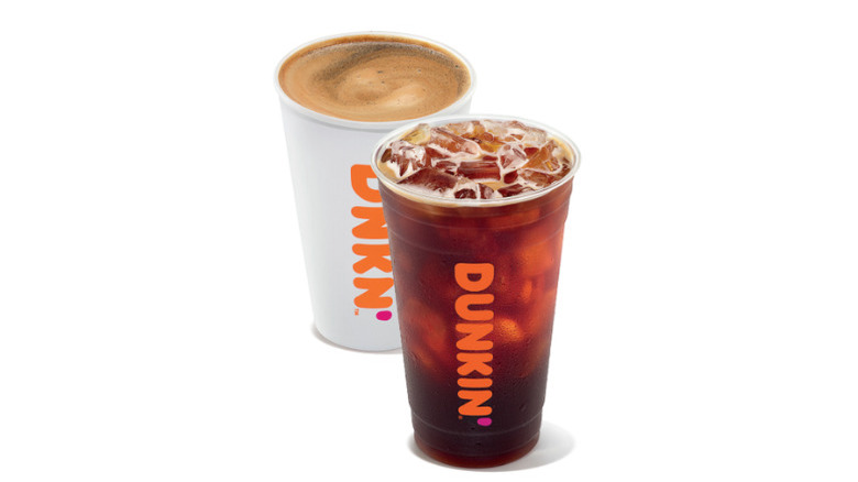 Paper cup and plastic cup of hot and iced Americanos from Dunkin'
