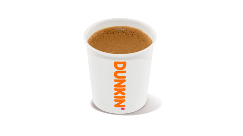 Cup of Dunkin' espresso on white background