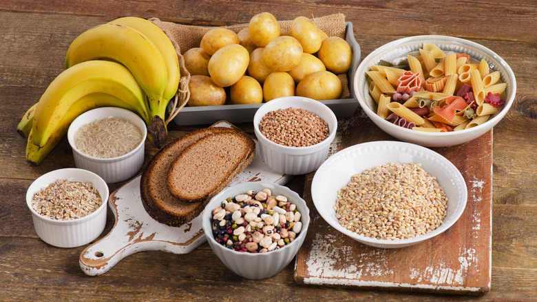 Foods high in carbohydrate on wooden background