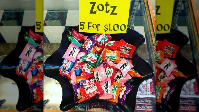 zotz candy in bowl with sign
