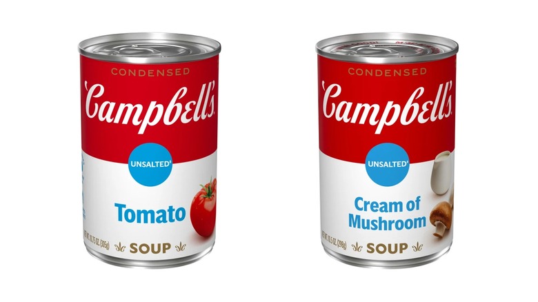 Cans of unsalted cream of tomato and mushroom soups side by side