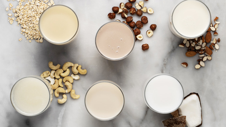Six glasses of plant and nut-based milks