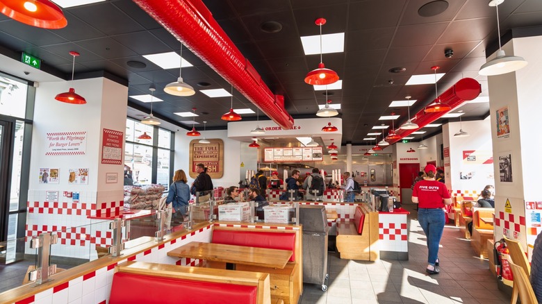 five guys restaurant interior with customers