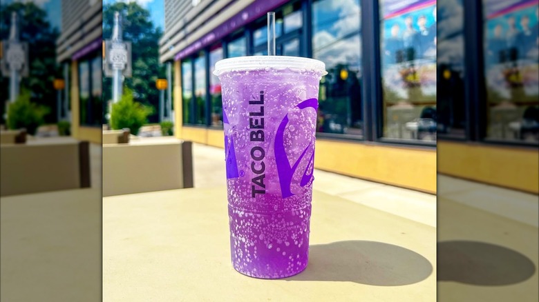 Cup of purple mountain dew on outdoor table
