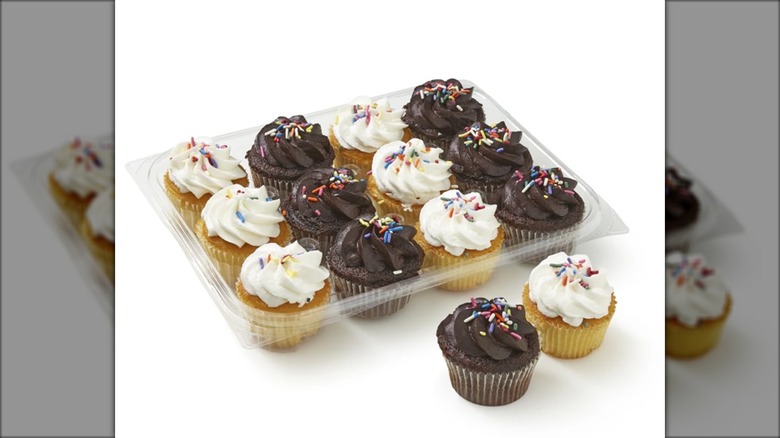 chocolate and vanilla cupcakes in a plastic box