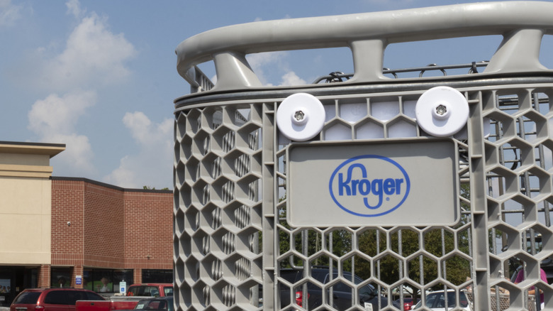 kroger shopping cart in front of kroger entrance