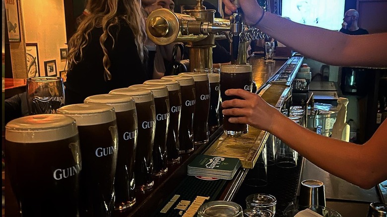 A line of Guinness pints at Emmets Irish Pub in Boston