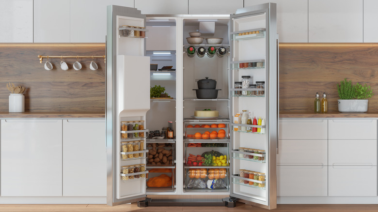Open refrigerator displaying variety of foods