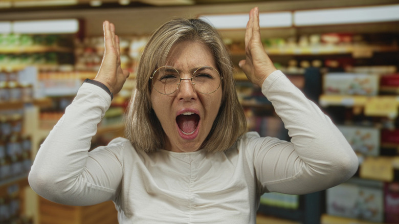 Irritated woman in a store