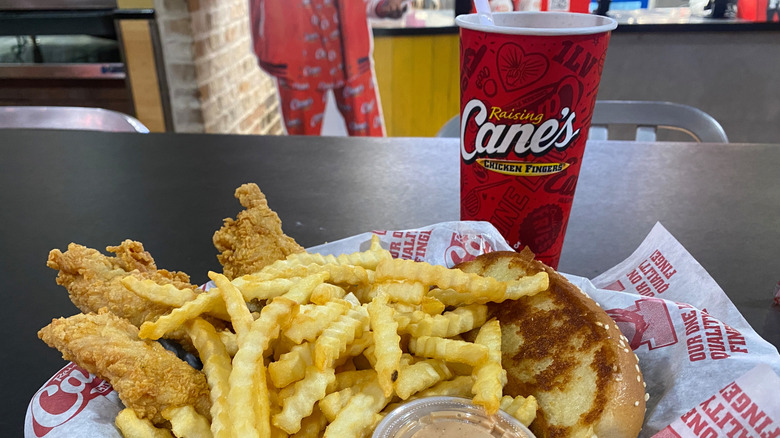 Raising Cane's meal with branded cup and paper wrapper.