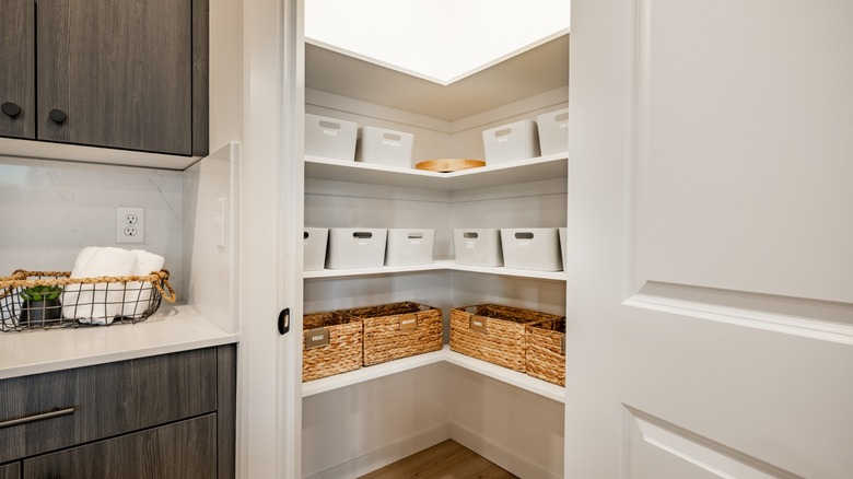 labeled baskets on pantry shelves
