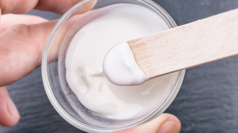 Baking soda paste on wooden stick