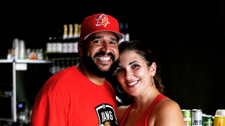 Jason Hadley posing for photograph with his wife Claudia
