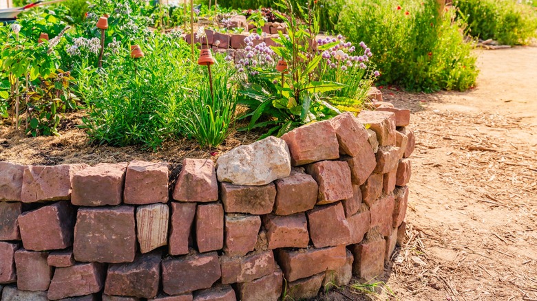herb garden surrounded by rocks