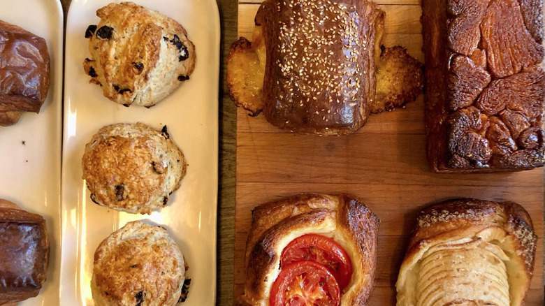 Overhead images of baked goods on wooden tables in bakery