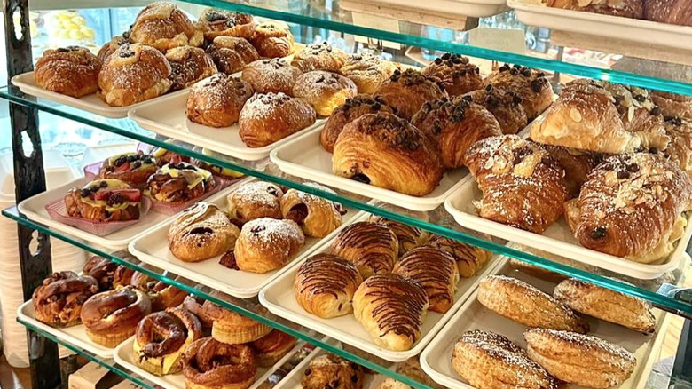 Pastry display with trays of different baked goods