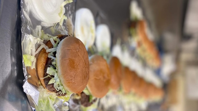 A line of burgers at Judice Inn in Louisiana