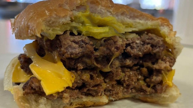 A half-eaten burger from Nick's Hamburger Shop in South Dakota