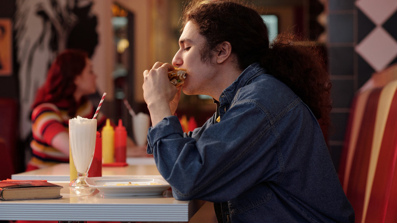 Someone eating at a diner