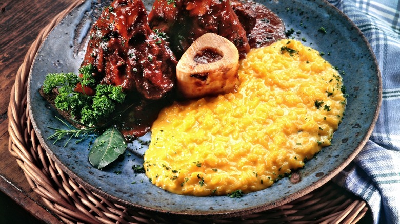 osso bucco with polenta on blue plate