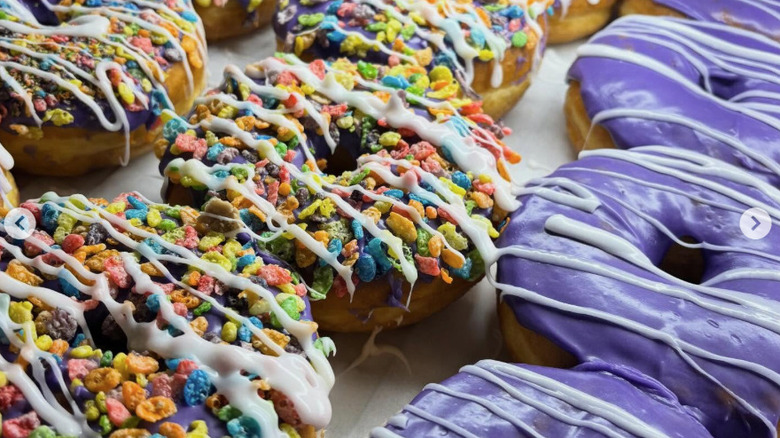 Selection of donuts with Fruity Pebbles cereal or an ube coating