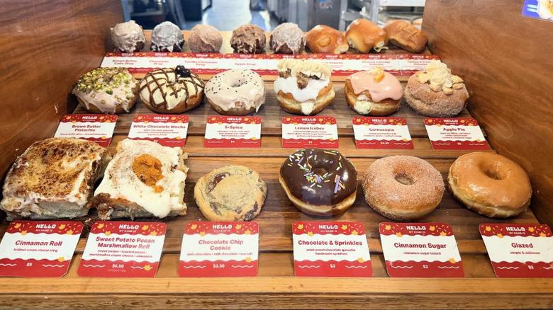 Selection of baked goods for sale, including donuts, rolls, and cookies