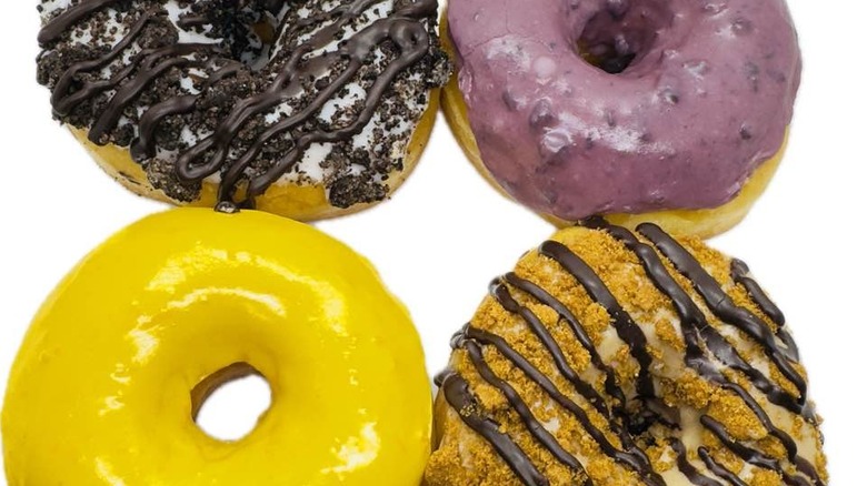 Four donuts in a square on a white background