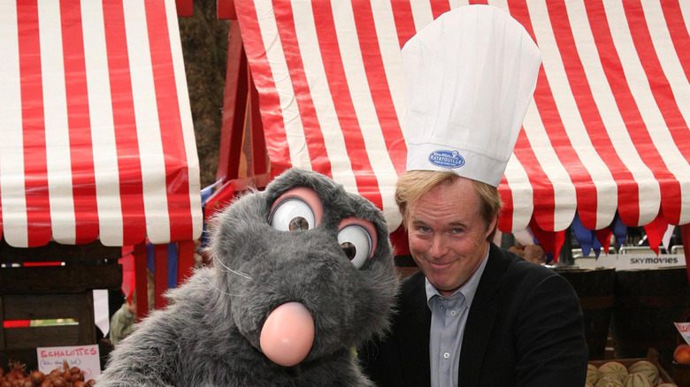 Brad Bird posing with person in rat costume for "Ratatouille" release
