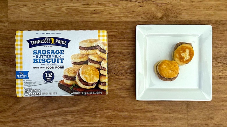 Package and cooked Odom's Tennessee Pride Sausage & Buttermilk Biscuit Sandwiches on square white plate