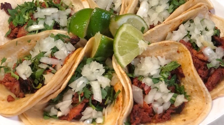 A plate of tacos from Andale Taqueria Y Mercado Mexican restaurant