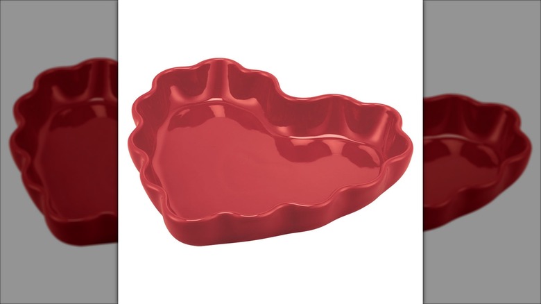 red fluted ceramic baking dish shaped like a heart