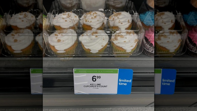 key lime cupcakes in plastic container in bakery