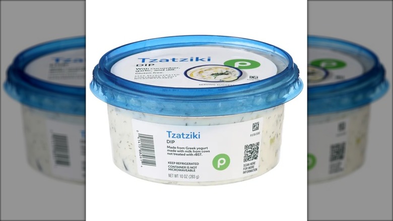 plastic container of publix tzatziki dip with blue lid