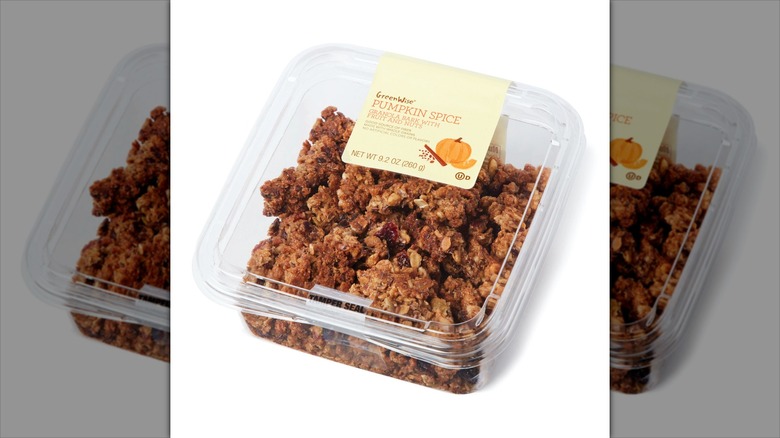 plastic container with clusters of granola