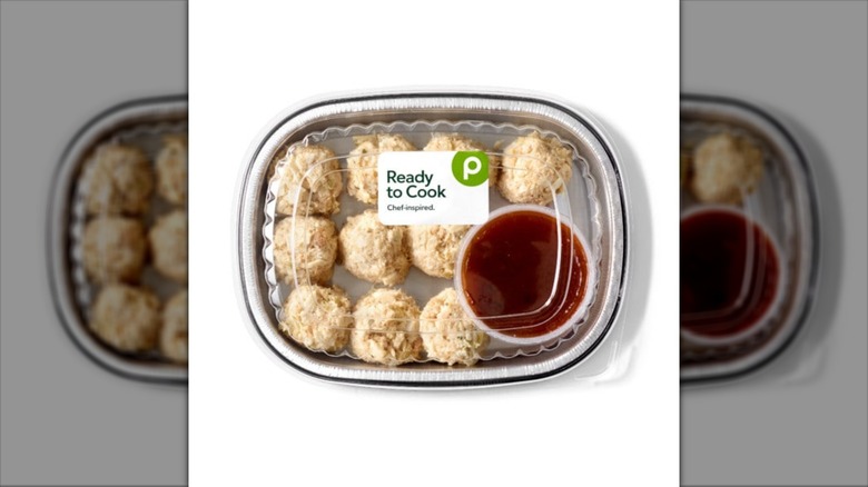 crab cake balls with dipping sauce in container