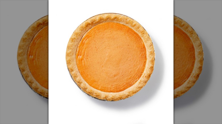 round pumpkin pie with golden crust