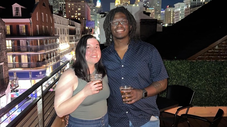 A couple enjoying the view from Mambo's rooftop in Louisiana