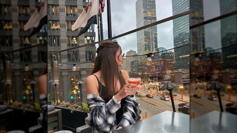 A woman looking out from Raised An Urban Rooftop Bar in Illinois