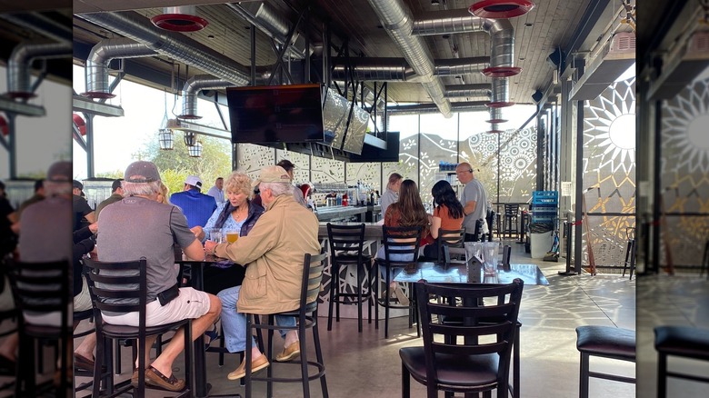 People enjoying the rooftop bar at The Perch Brewery in Arizona