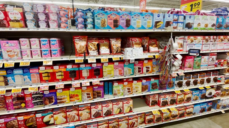 Array of cake mixes on grocery store shelf