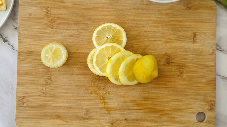 lemon wheels on a wooden board