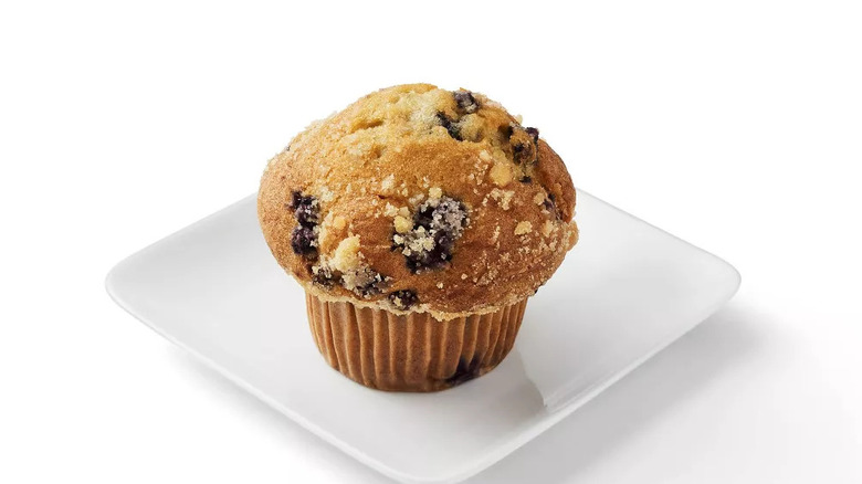 Blueberry streusel muffin on white plate