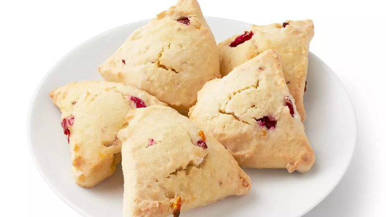 White plate with pile of mini orange cranberry scones