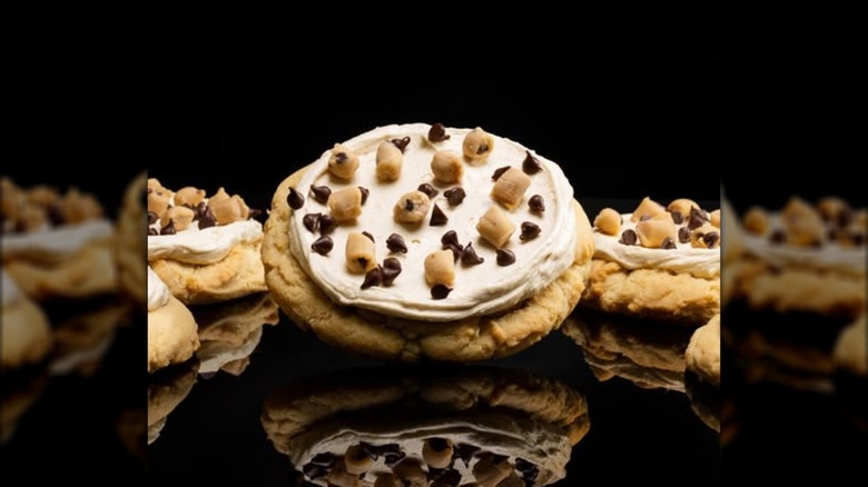 crumbl cookie dough cookie against black background