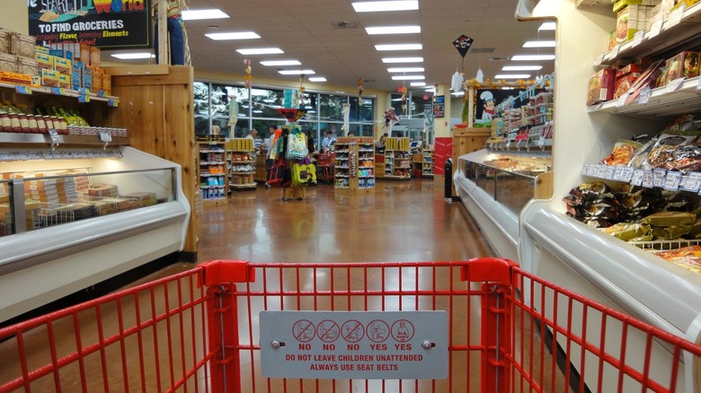 pushing shopping cart through trader joe's